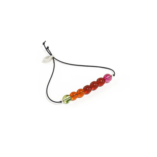 Pulsera multicolor elástica, liviana, cómoda, versátil y atemporal. Diseño conceptual latinoamericano. Escala micro.