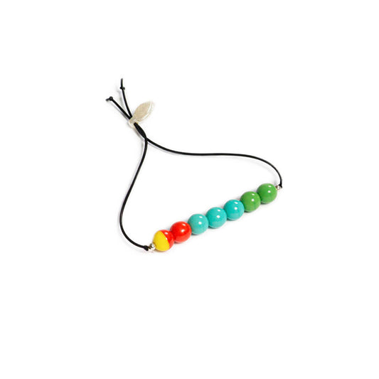 Pulsera multicolor elástica, liviana, cómoda, versátil y atemporal. Diseño conceptual latinoamericano. Escala micro.