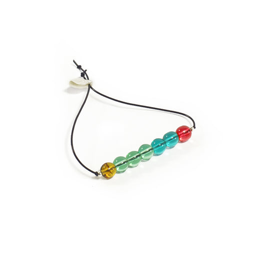 Pulsera multicolor elástica, liviana, cómoda, versátil y atemporal. Diseño conceptual latinoamericano. Escala micro.