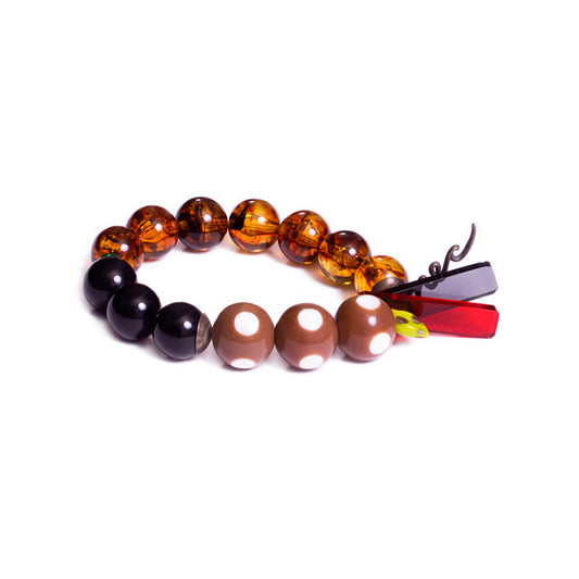 Pulsera multicolor elástica, liviana, cómoda, versátil y atemporal. Diseño conceptual latinoamericano. Escala macro.