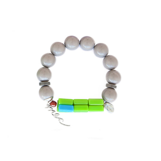 Pulsera multicolor elástica, liviana, cómoda, versátil y atemporal. Diseño conceptual latinoamericano. Escala macro.
