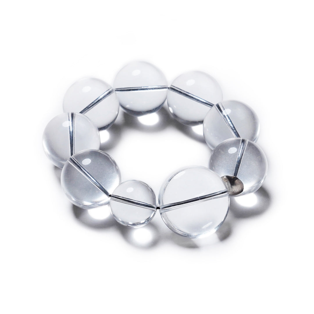 Pulsera transparente, elástica, liviana, cómoda, versátil y atemporal. Diseño conceptual latinoamericano. Escala ultra.